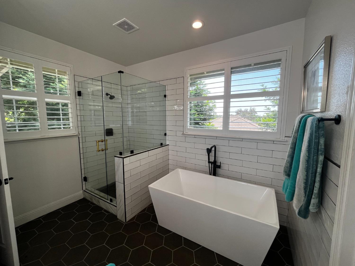 3497 Foxmore Lane Rescue, CA 95672 - Photo 35 of 83 a white bath tub sitting in a bathroom next to a window