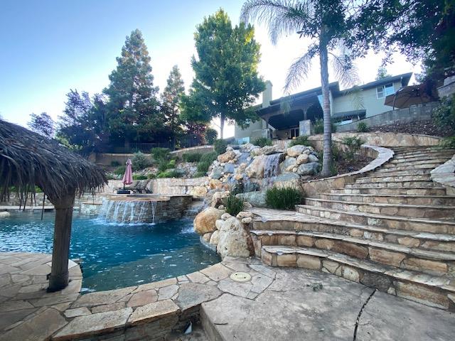 3497 Foxmore Lane Rescue, CA 95672 - Photo 57 of 83 Water falls, Spa, custom stone stairwell to pool