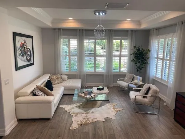 a white bath tub sitting in a bathroom next to a window
