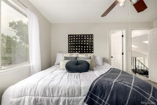 a bedroom with a bed and window
