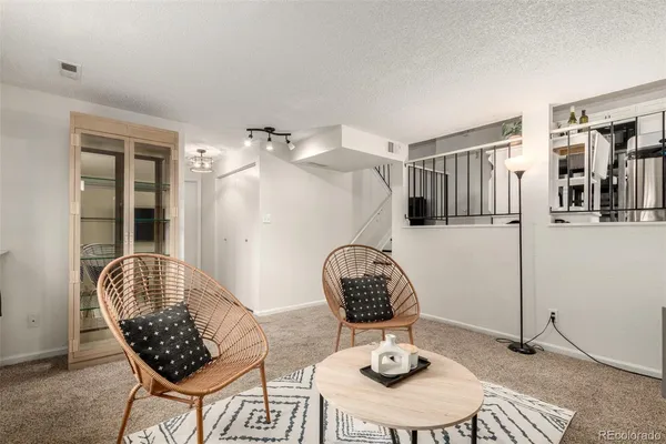a room with furniture and wooden floor