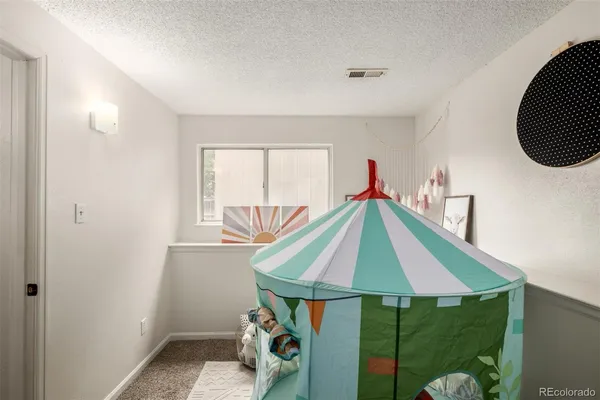 a room that has a bed and a window