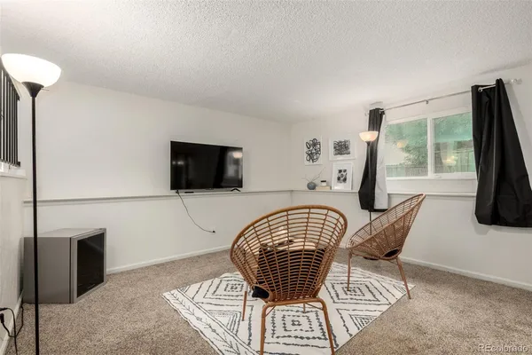 a view of a livingroom with furniture