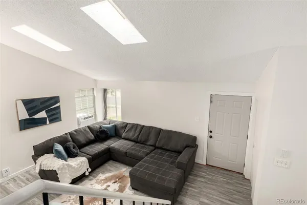 a living room with a couch and a flat screen tv
