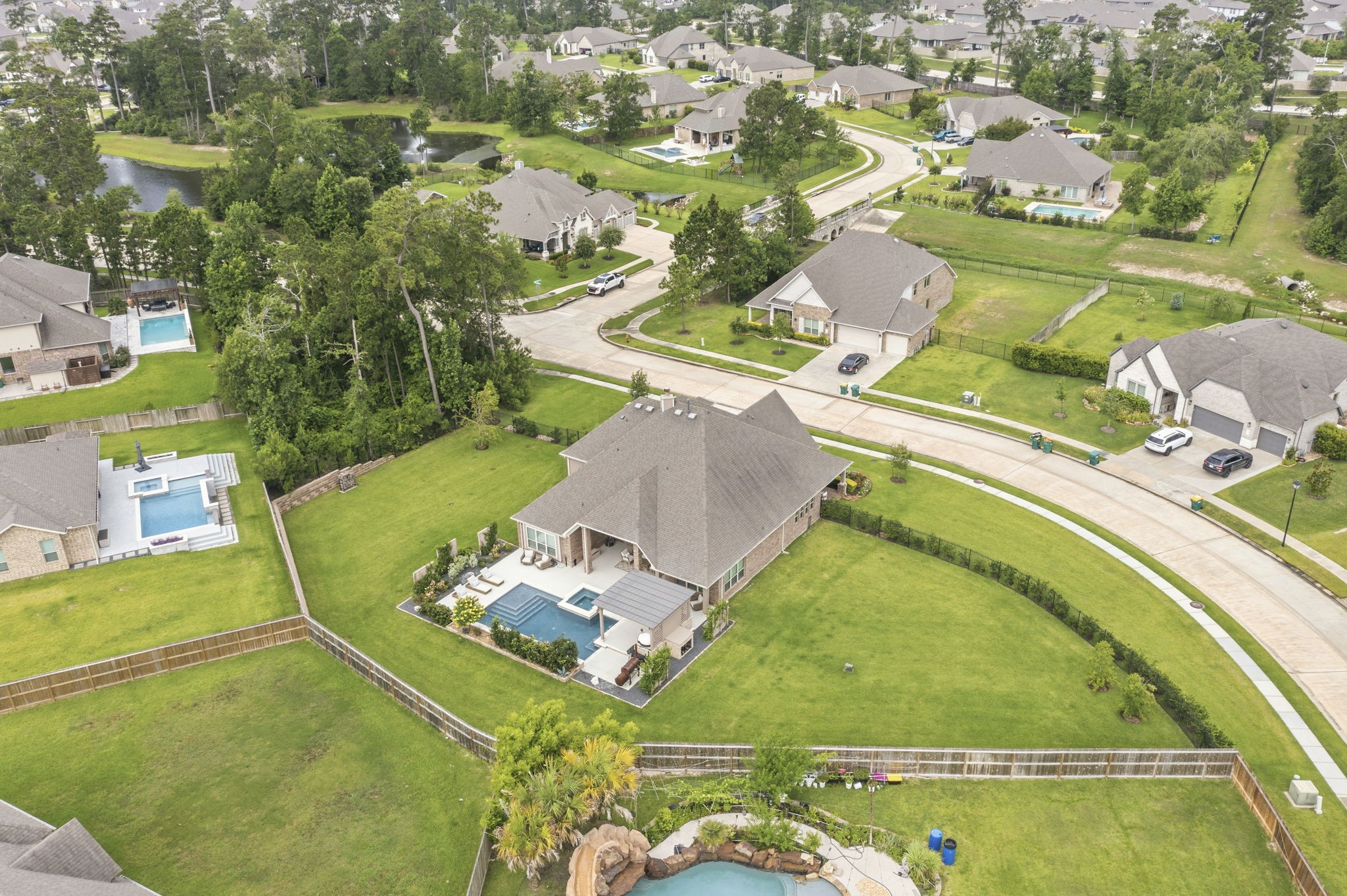 14012 Beartooth Bend Trail Conroe, TX 77384 - Photo 3 of 50 Located in a gated enclave of Fosters Ridge, this home sits on a premium 0.66 acre lot.