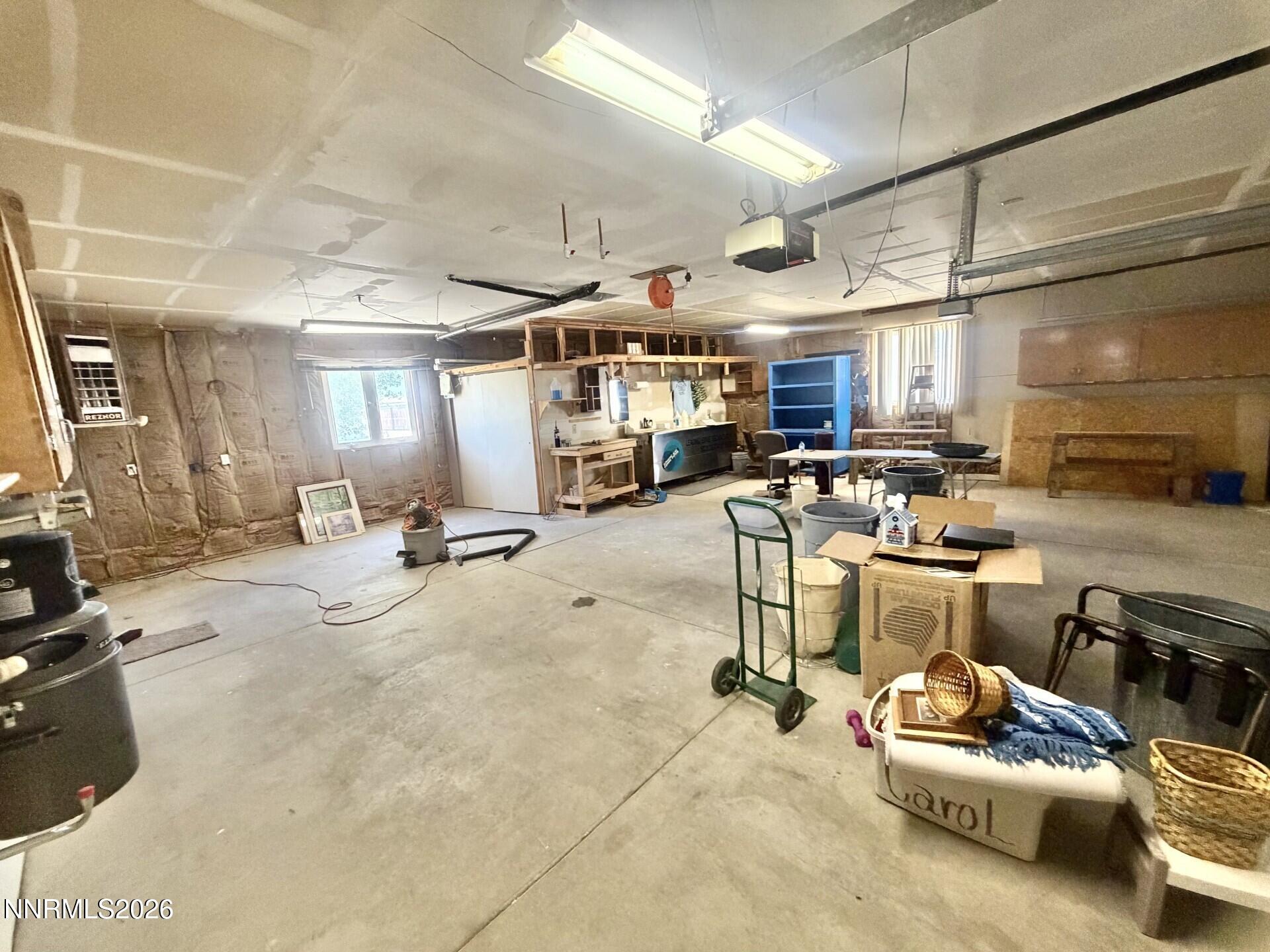 765 Hunter Park Way Fallon, NV 89406 - Photo 14 of 30 a room with lots of furniture and a kitchen view