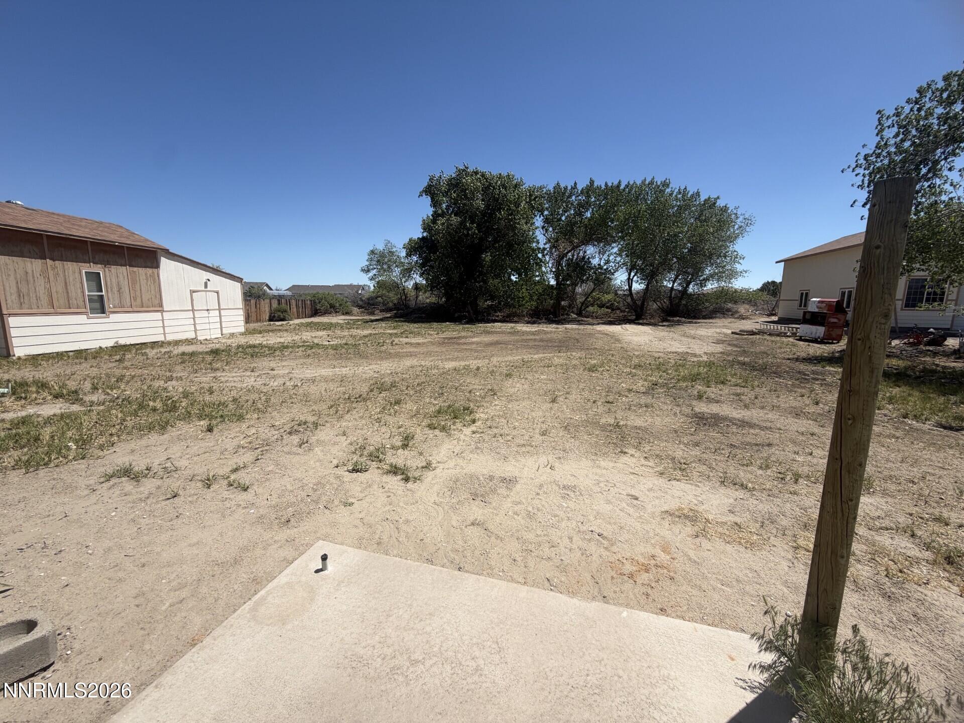 765 Hunter Park Way Fallon, NV 89406 - Photo 16 of 30 a view of a yard with a snow in the background
