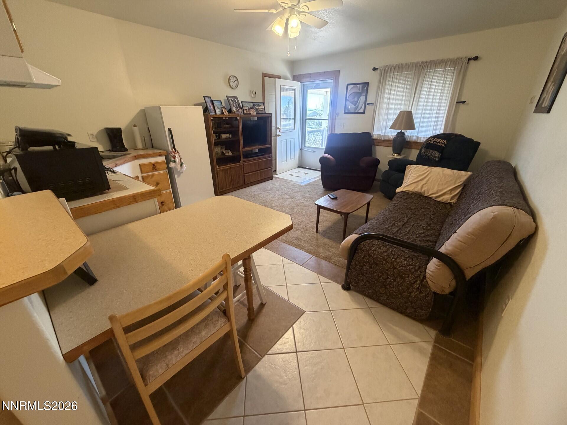 765 Hunter Park Way Fallon, NV 89406 - Photo 22 of 30 a living room with furniture and a flat screen tv