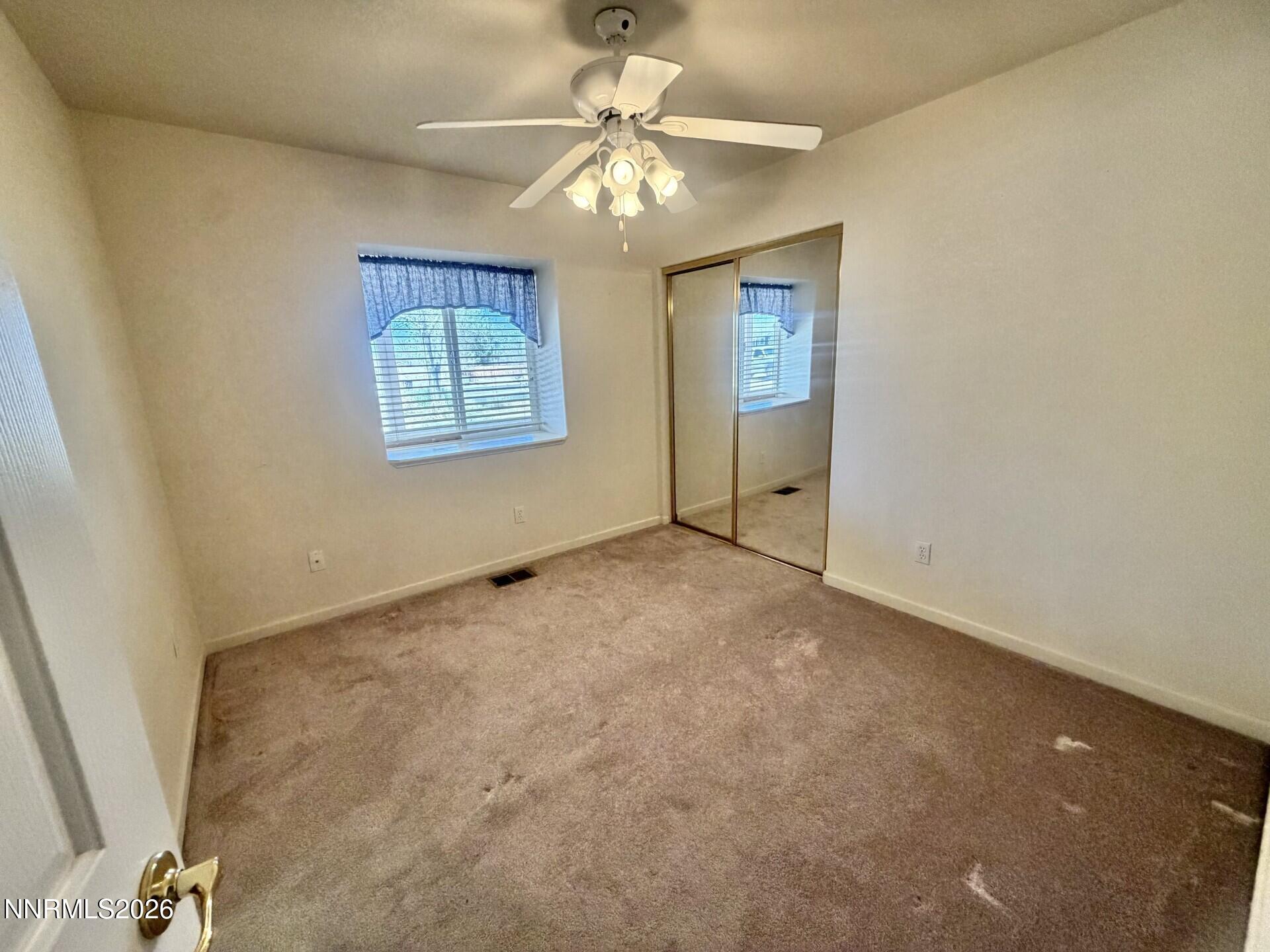 765 Hunter Park Way Fallon, NV 89406 - Photo 8 of 30 a view of an empty room with a window