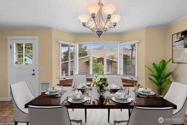 a view of a dining room with furniture window and outside view