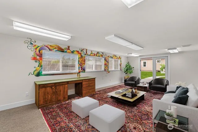 a living room with furniture and a rug