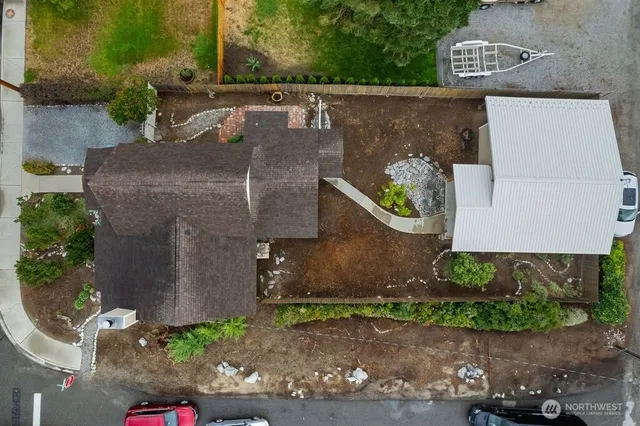 an aerial view of a house with a yard