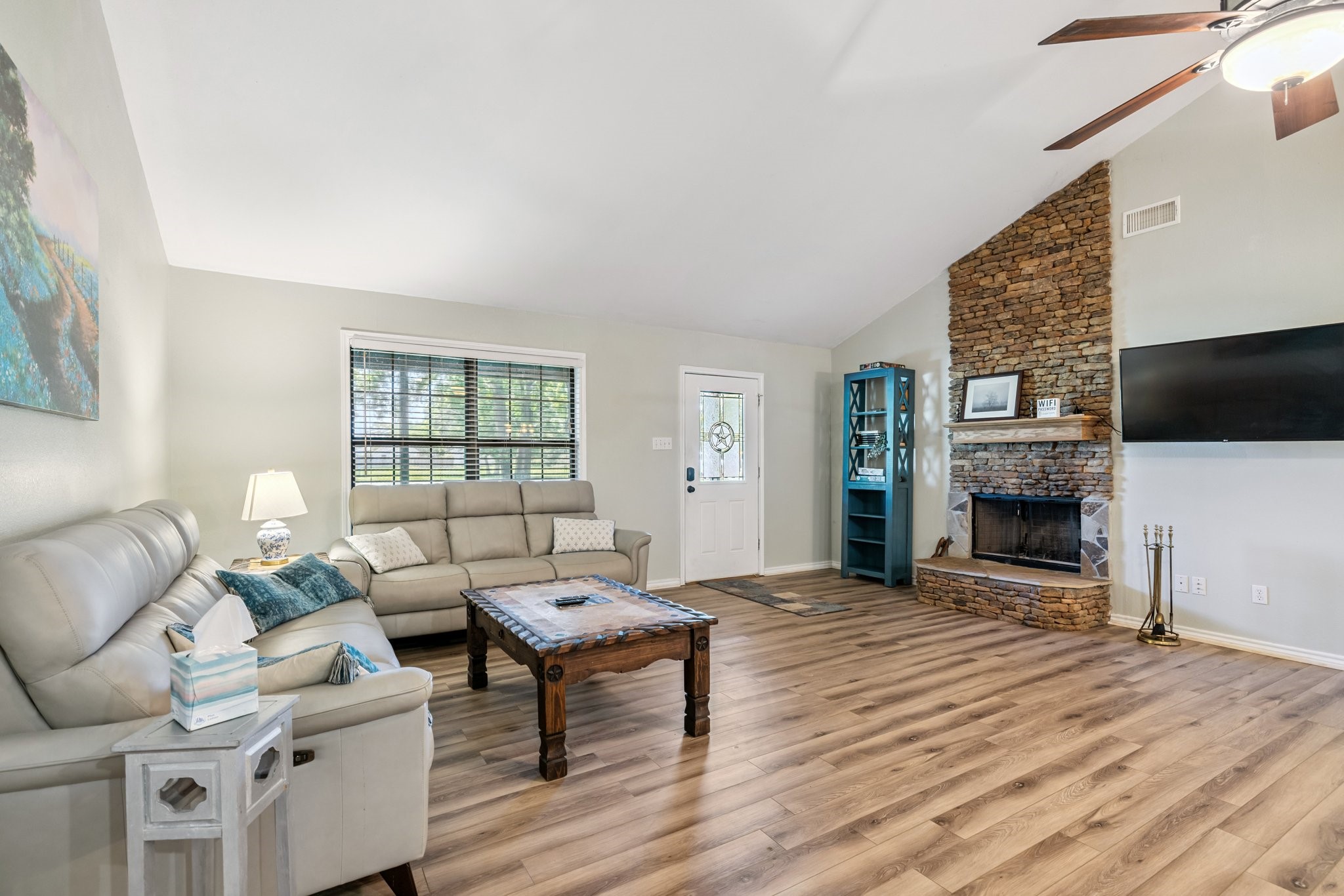 148 Crest Lane Onalaska, TX 77360 - Photo 13 of 38 Large den with vaulted ceiling and stone fireplace.