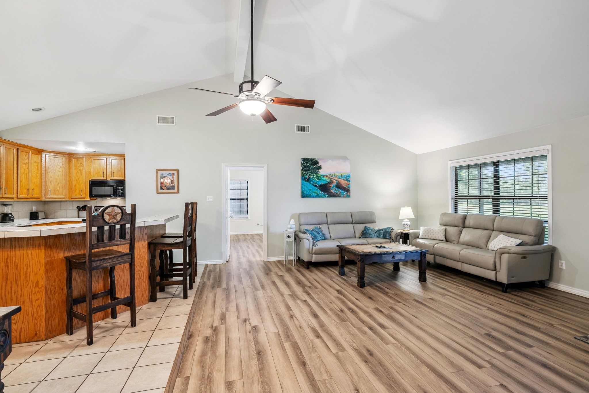 148 Crest Lane Onalaska, TX 77360 - Photo 16 of 38 Recent wood laminate floors in the living area and bedrooms.