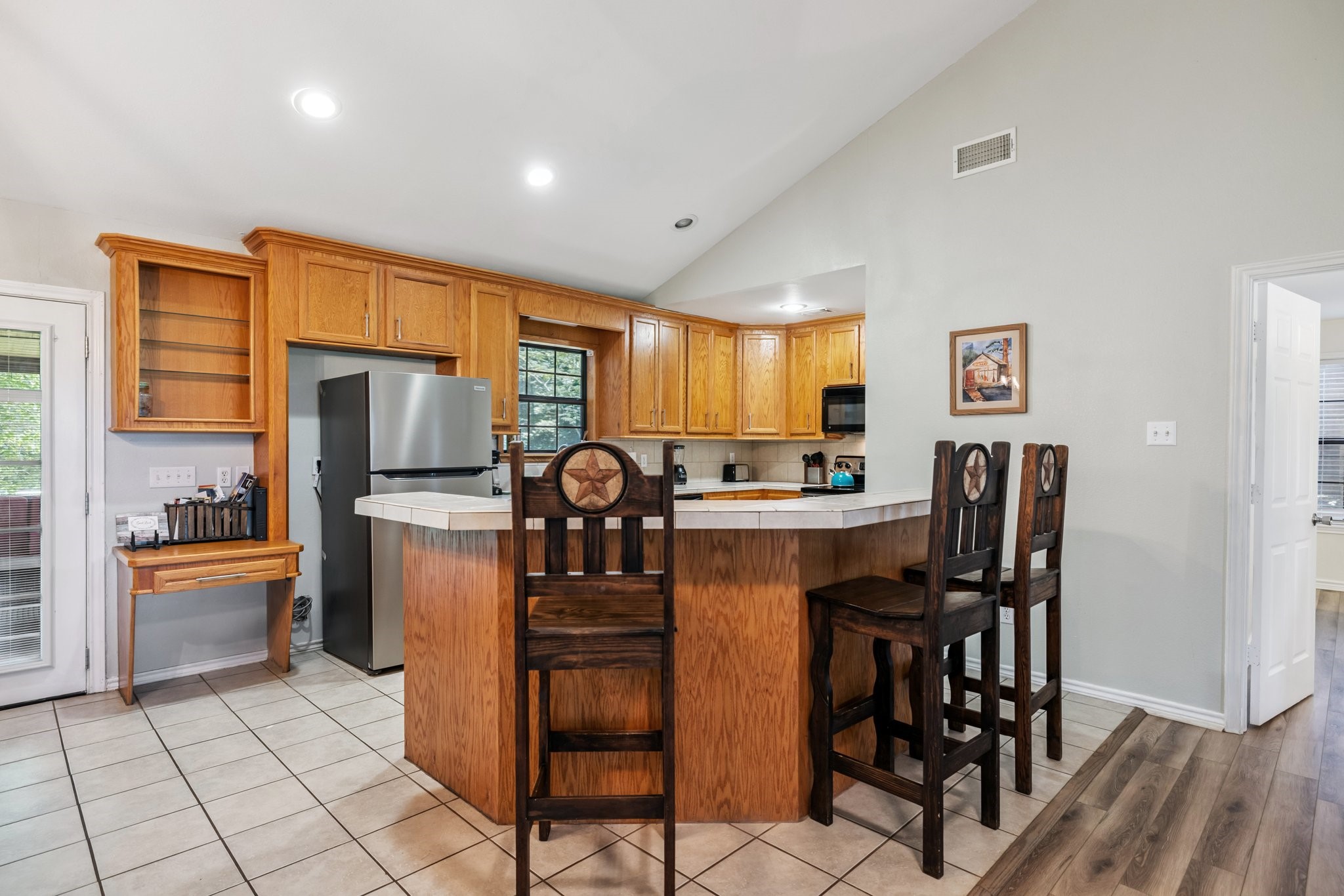 148 Crest Lane Onalaska, TX 77360 - Photo 18 of 38 Kitchen with breakfast bar, open to living area.