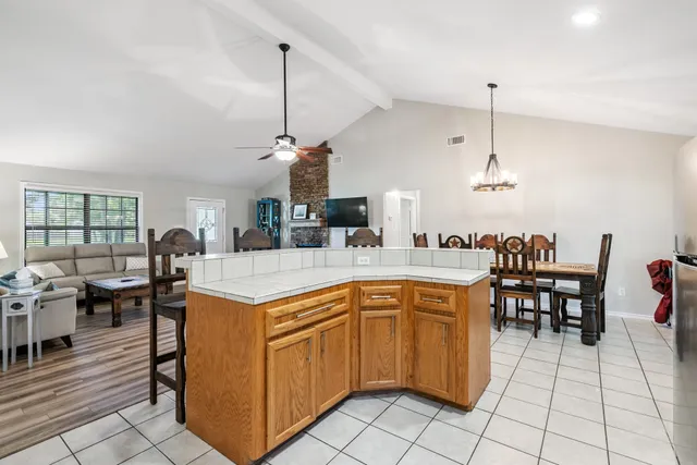 a kitchen that has a lot of cabinets in it