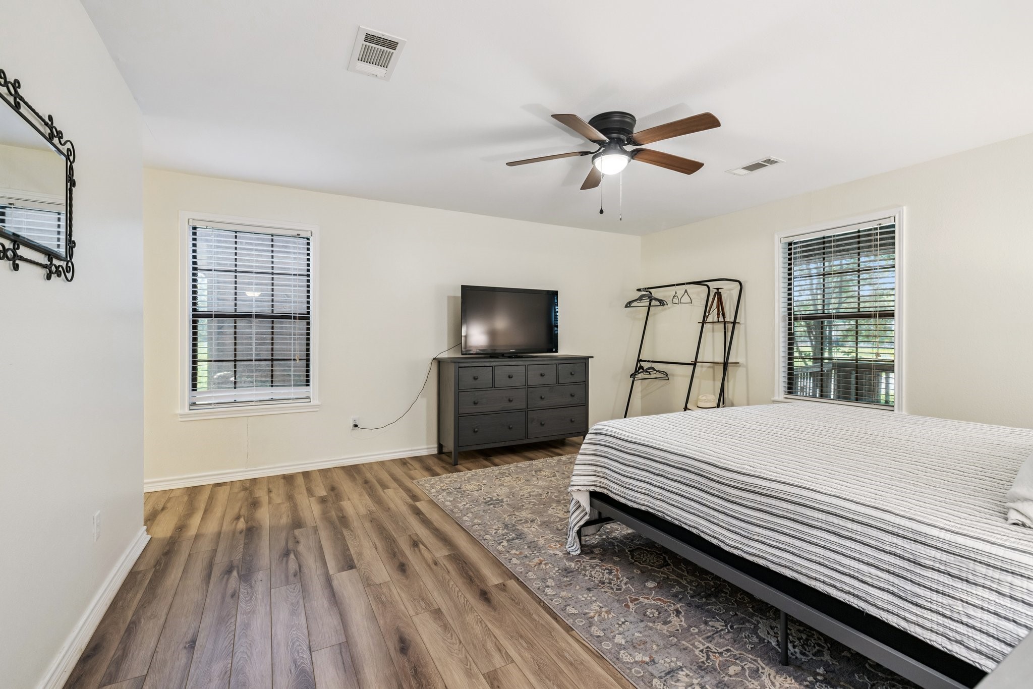 148 Crest Lane Onalaska, TX 77360 - Photo 23 of 38 Primary bedroom with large windows.