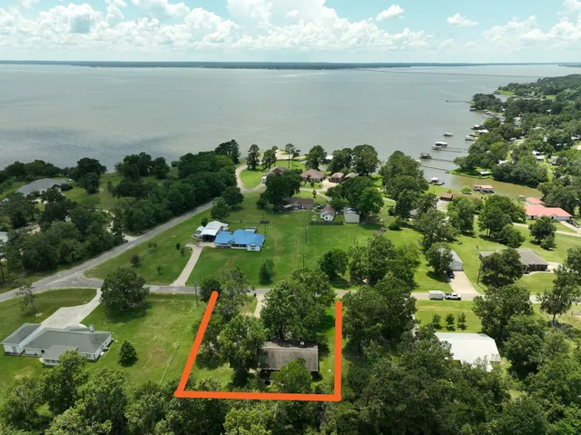 an aerial view of houses with yard