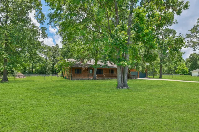 a backyard of a house with lots of green space