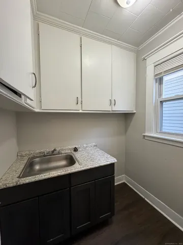 a kitchen with a sink and cabinets