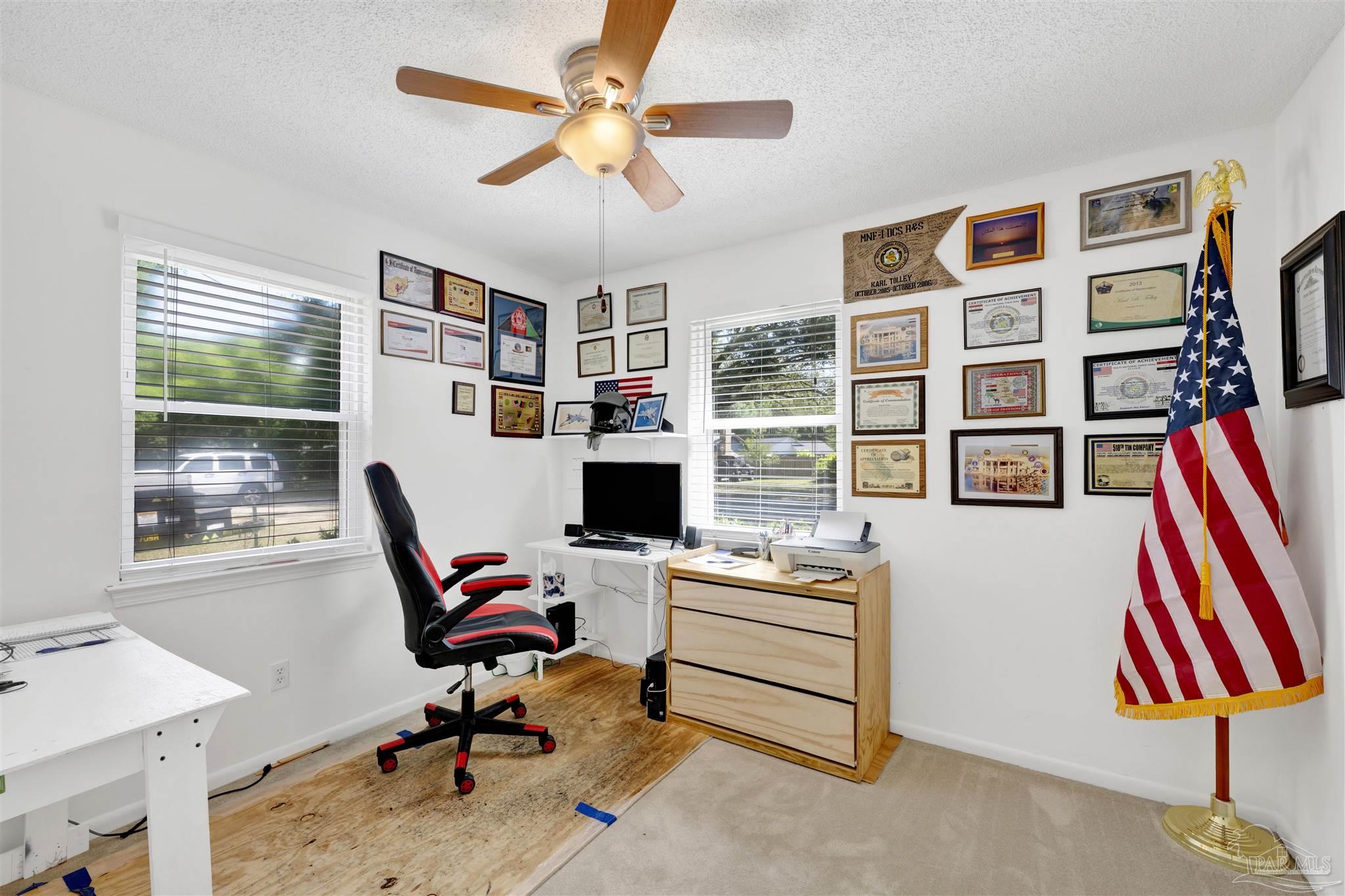 5131 Oakleaf Drive Pace, FL 32571 - Photo 12 of 23 a view of a workspace with furniture and a window