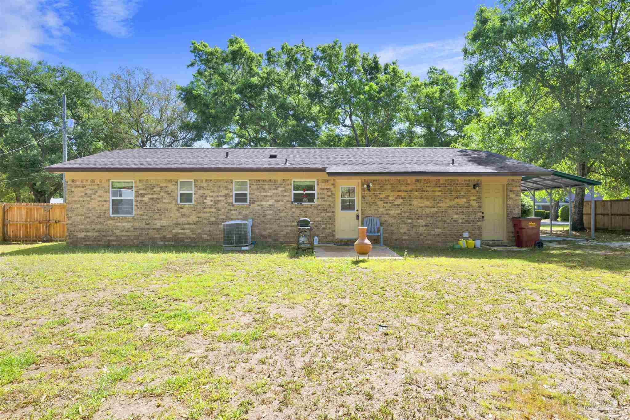 5131 Oakleaf Drive Pace, FL 32571 - Photo 16 of 23 a backyard of a house