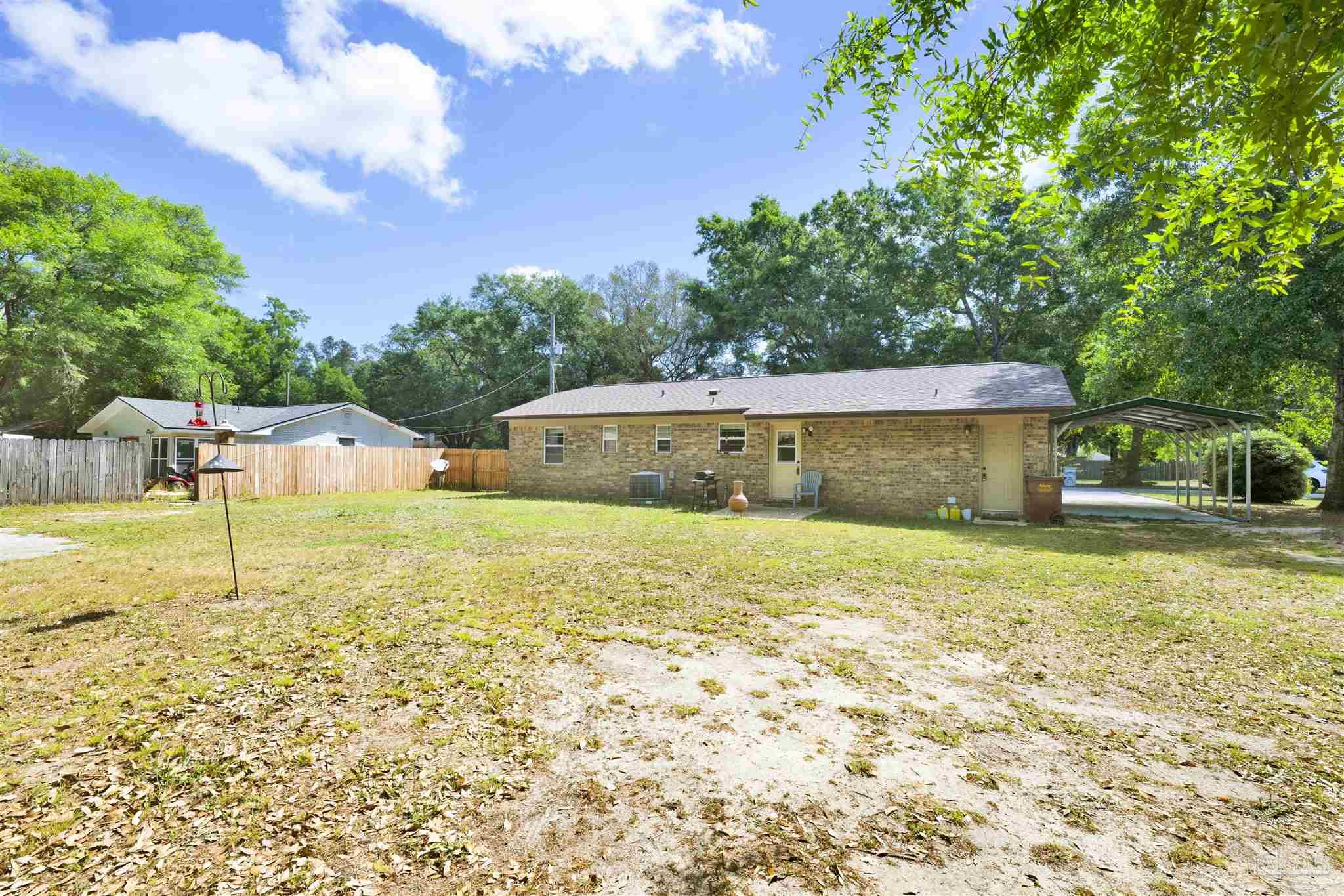 5131 Oakleaf Drive Pace, FL 32571 - Photo 17 of 23 a house view with a garden space