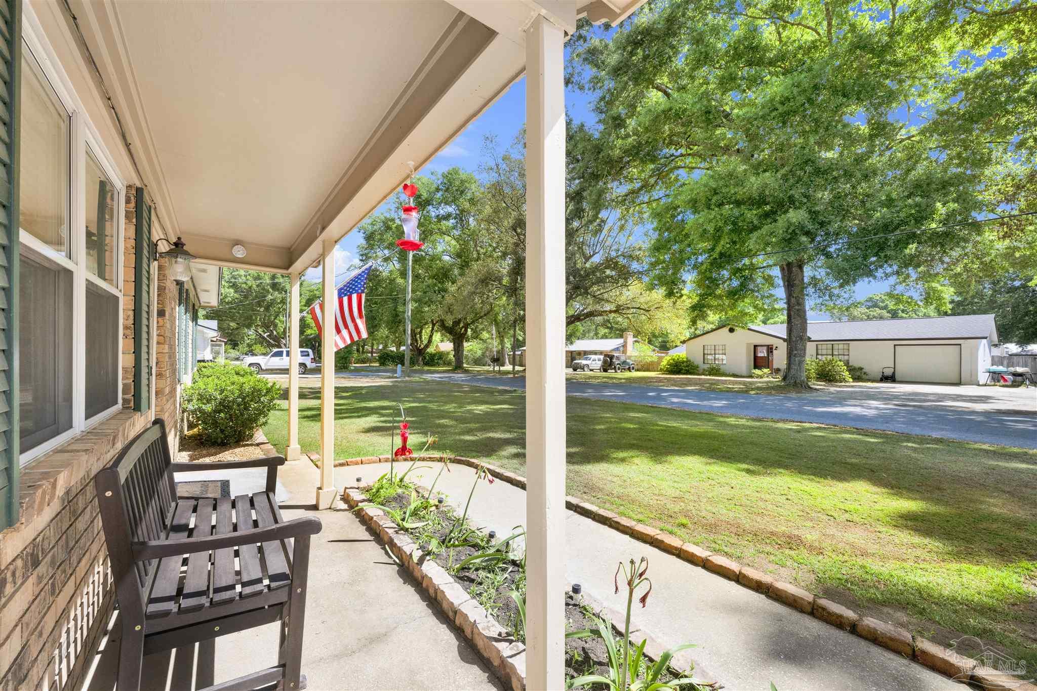 5131 Oakleaf Drive Pace, FL 32571 - Photo 2 of 23 a view of swimming pool with a patio