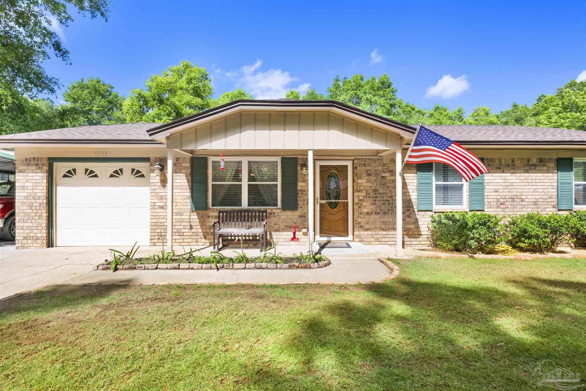 5131 Oakleaf Drive Pace, FL 32571 - Photo 21 of 23 a front view of house with yard and green space