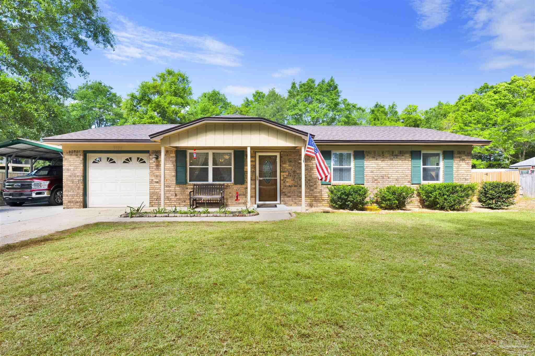 5131 Oakleaf Drive Pace, FL 32571 - Photo 22 of 23 a front view of a house with a yard