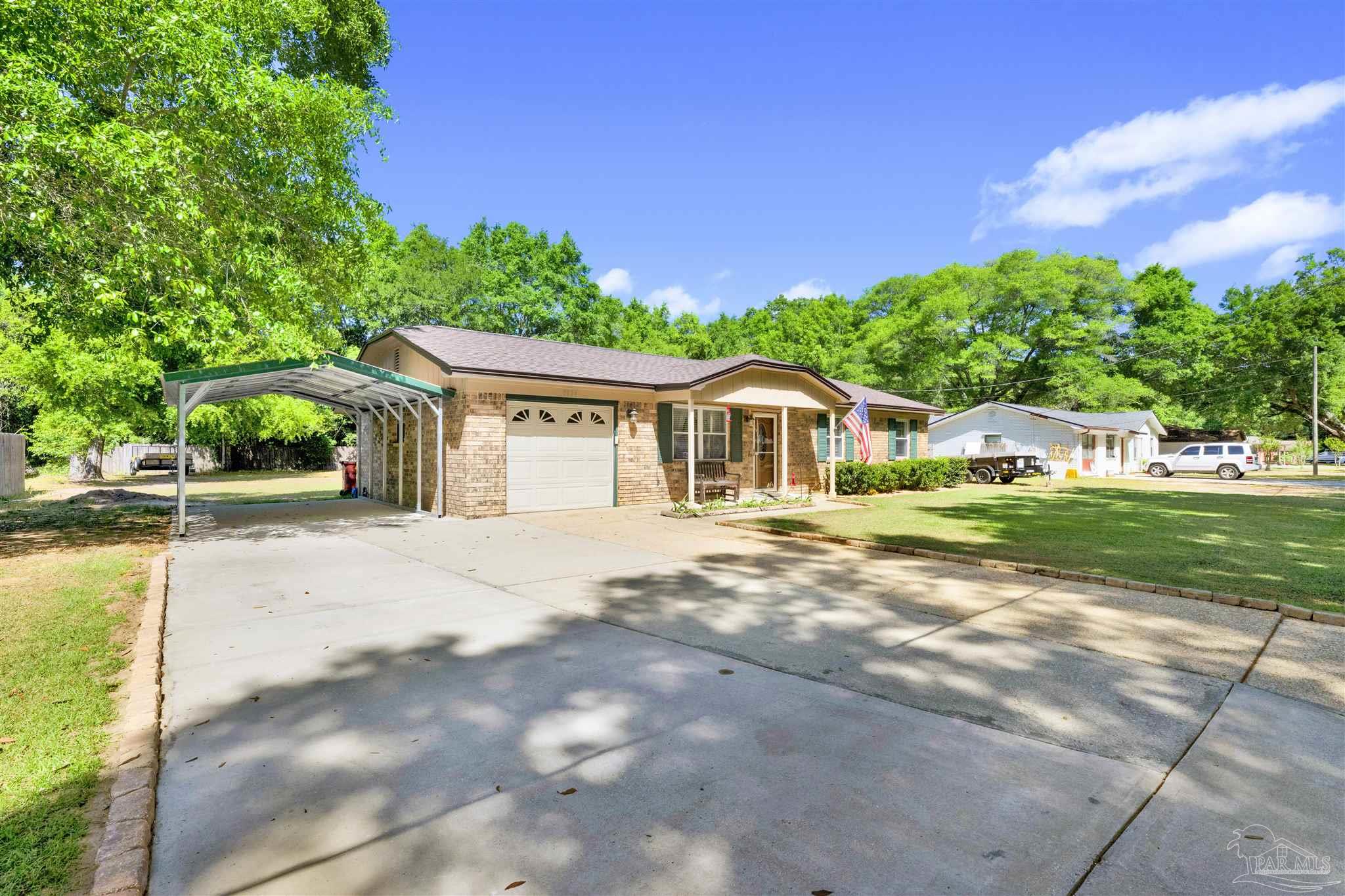 5131 Oakleaf Drive Pace, FL 32571 - Photo 23 of 23 a aerial view of a house with garden