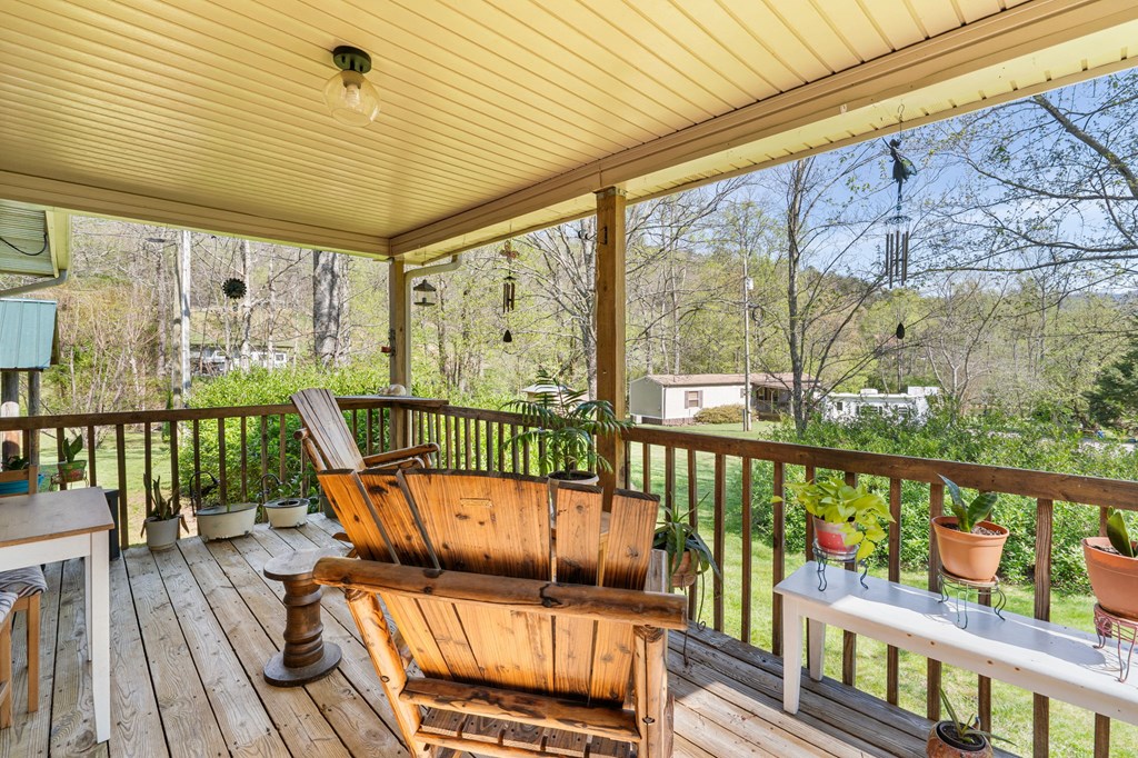 496 Jackie Cove Road Hayesville, NC 28904 - Photo 13 of 41 a view of a balcony with furniture