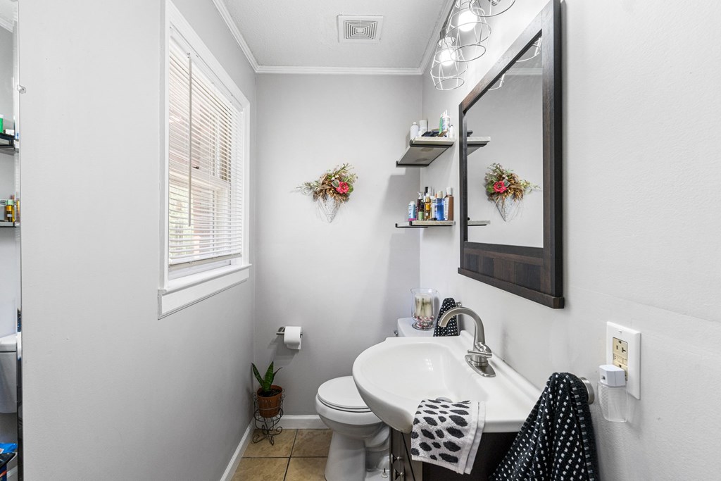 496 Jackie Cove Road Hayesville, NC 28904 - Photo 15 of 41 a bathroom with a sink toilet and mirror