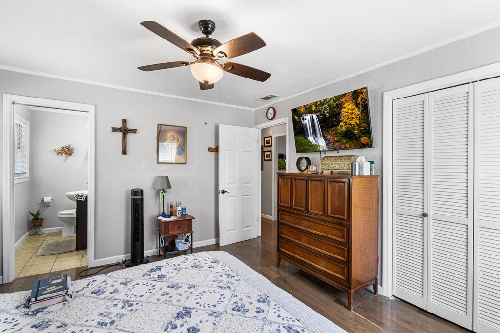 496 Jackie Cove Road Hayesville, NC 28904 - Photo 16 of 41 a bedroom with furniture and a flat screen tv