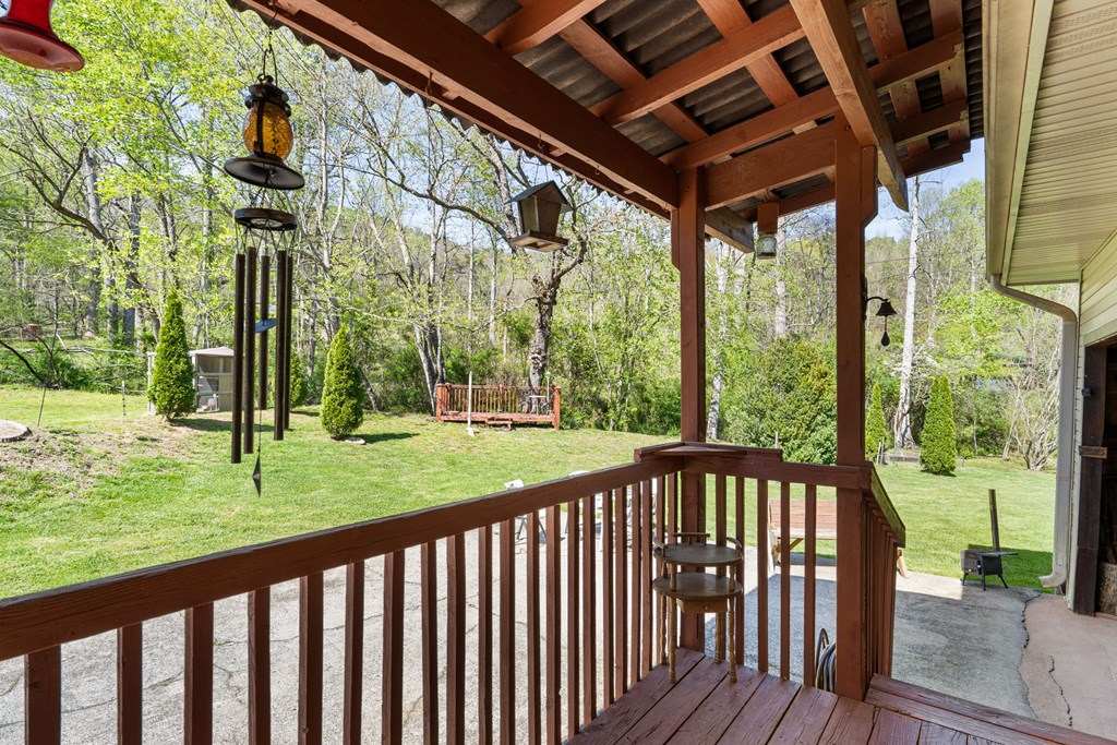 496 Jackie Cove Road Hayesville, NC 28904 - Photo 22 of 41 a view of a porch with a yard