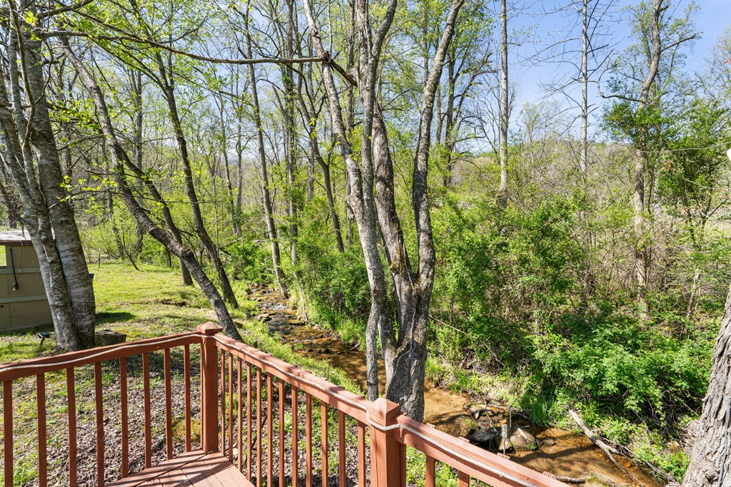 496 Jackie Cove Road Hayesville, NC 28904 - Photo 25 of 41 a view of a wooden balcony and trees