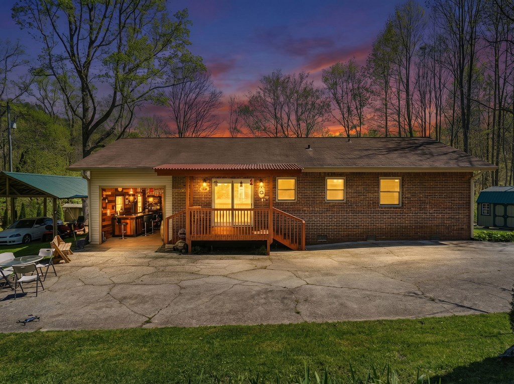496 Jackie Cove Road Hayesville, NC 28904 - Photo 31 of 41 a view of a house with a patio