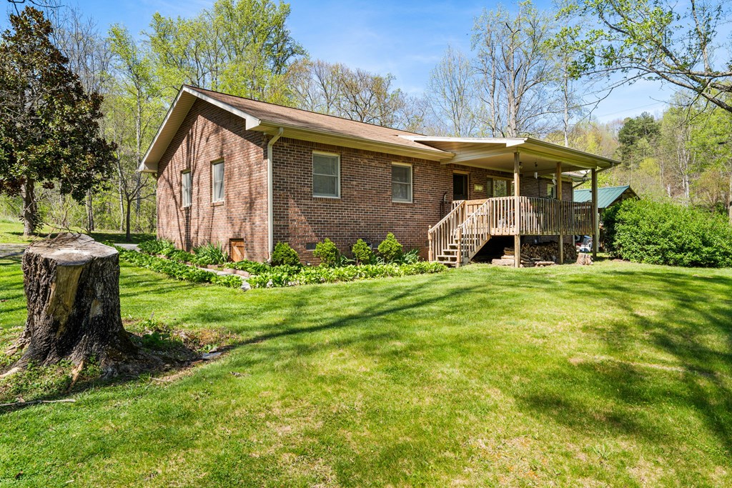 496 Jackie Cove Road Hayesville, NC 28904 - Photo 33 of 41 a front view of a house with garden
