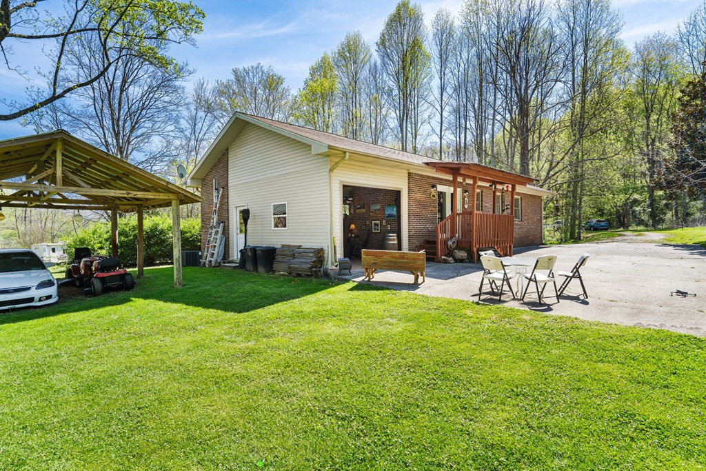 496 Jackie Cove Road Hayesville, NC 28904 - Photo 36 of 41 a view of a house with backyard and sitting area