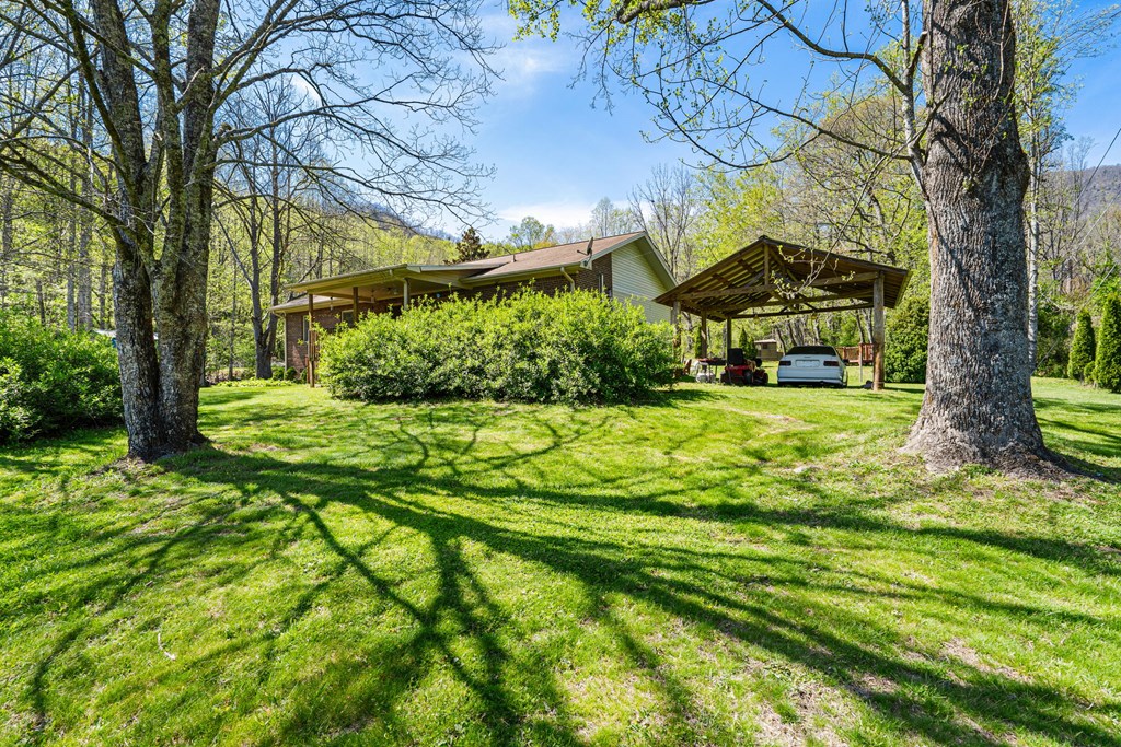 496 Jackie Cove Road Hayesville, NC 28904 - Photo 38 of 41 a view of a backyard with garden
