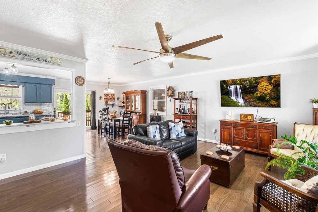 496 Jackie Cove Road Hayesville, NC 28904 - Photo 8 of 41 a living room with fireplace furniture and a flat screen tv
