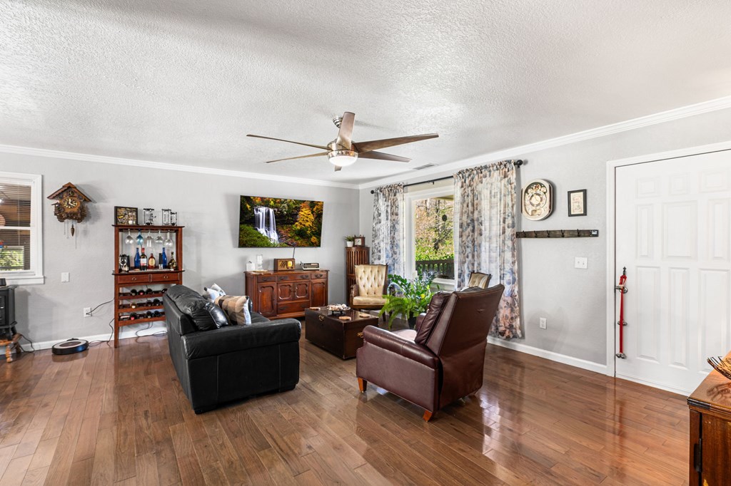496 Jackie Cove Road Hayesville, NC 28904 - Photo 10 of 41 a living room with furniture and a wooden floor