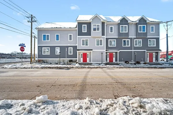 a front view of an buildings with a road