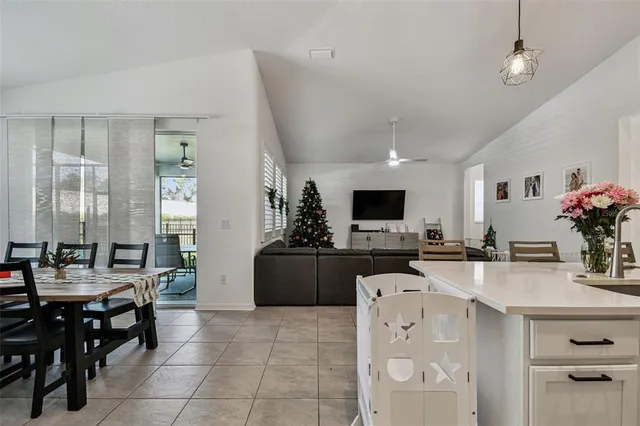 a kitchen with lots of counter top space a sink appliances and cabinets