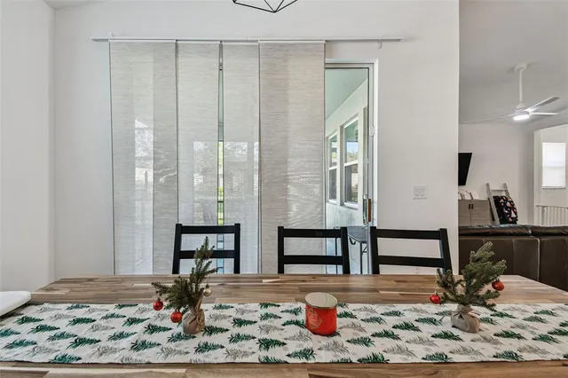 a kitchen with granite countertop a counter space dining table and stainless steel appliances