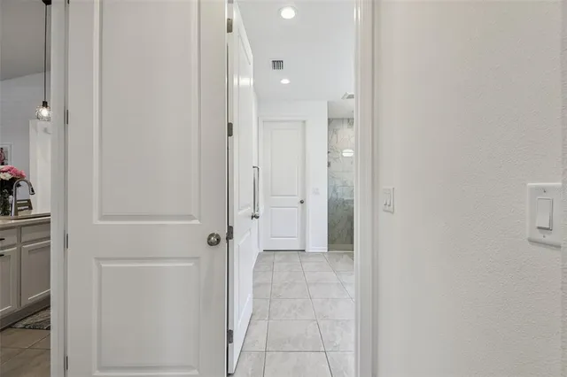 a spacious bathroom with a sink shower and a mirror