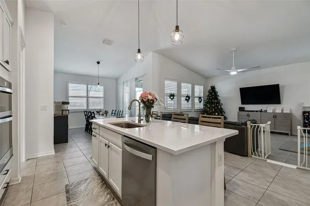a large kitchen with kitchen island a sink counter space and stainless steel appliances
