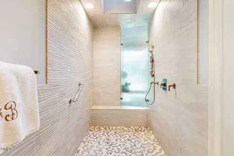 a spacious bathroom with a granite countertop sink and a mirror