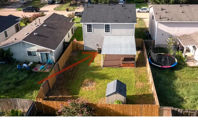 an aerial view of residential houses with outdoor space
