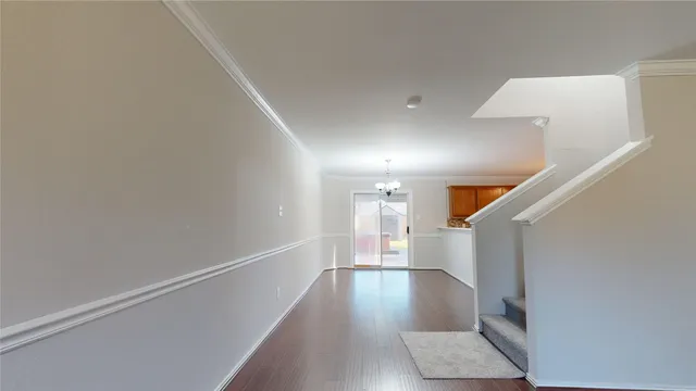 a view of entryway with wooden floor